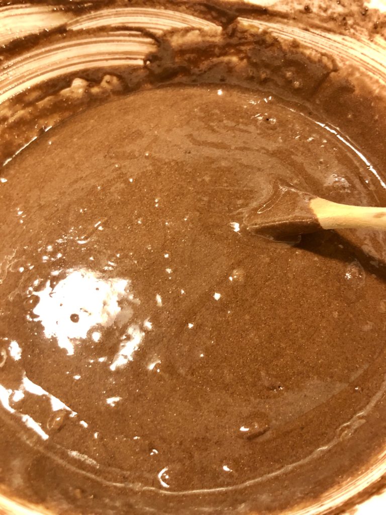 prepared cake batter from a box mix in a large white mixing bowl