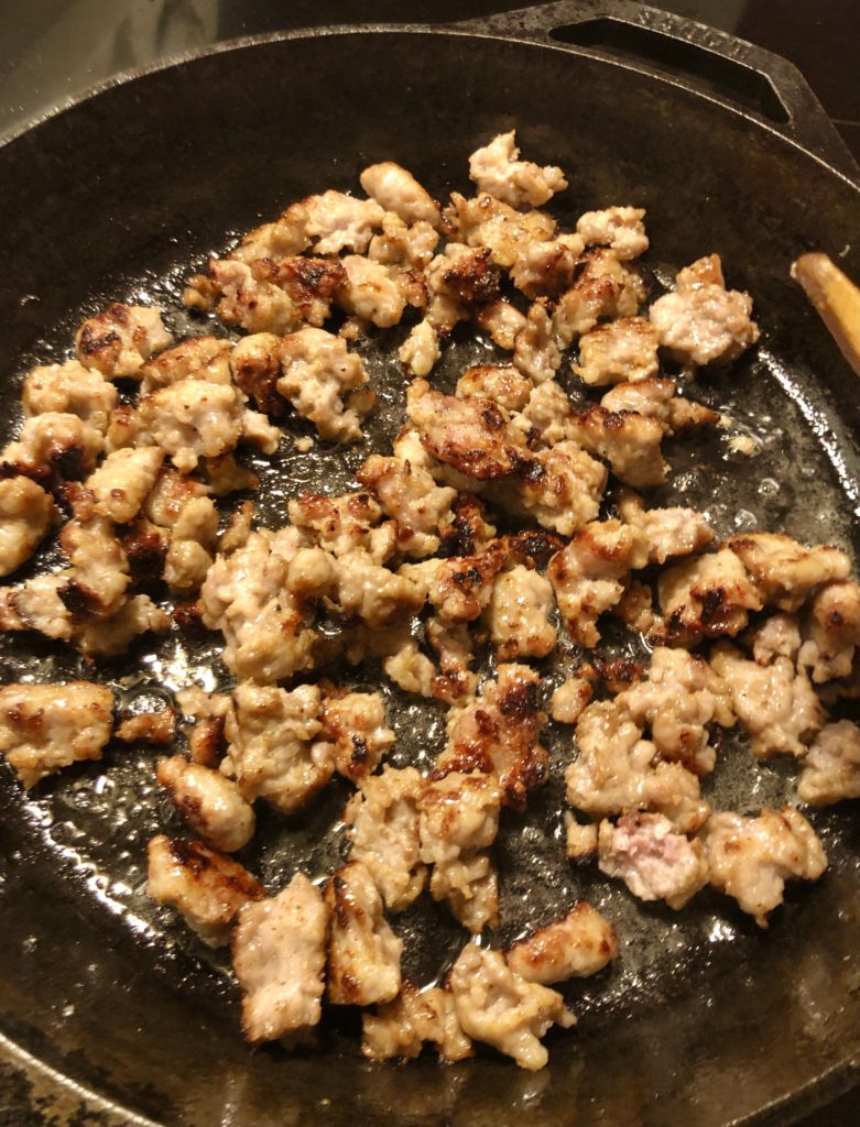 Italian sausage cooked in skillet