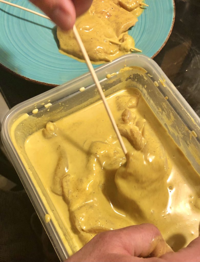 chix satay marinade being skewered