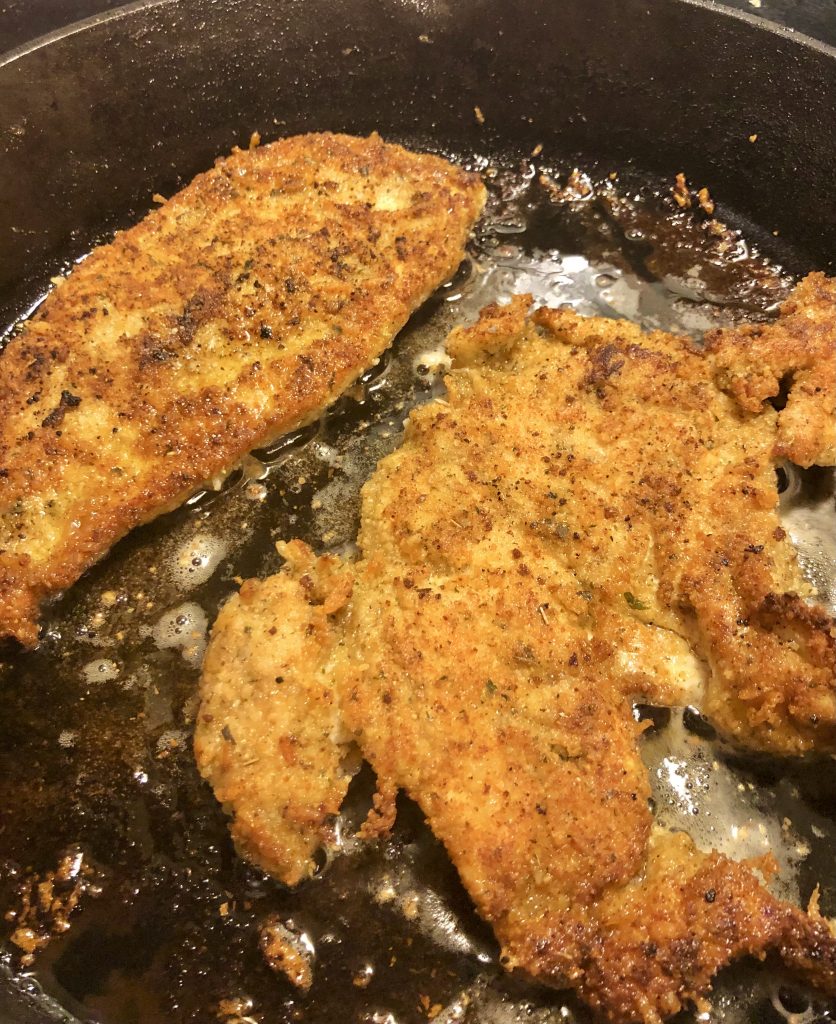 chicken parm chicken frying in pan
