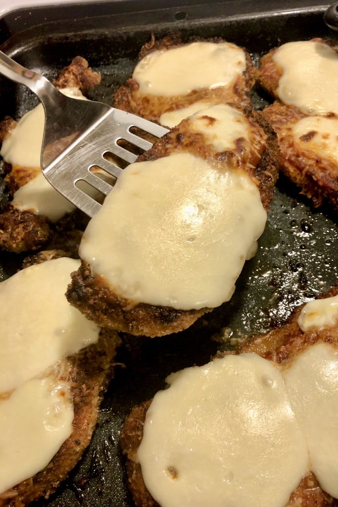 chicken parm with melted mozzarella after baking