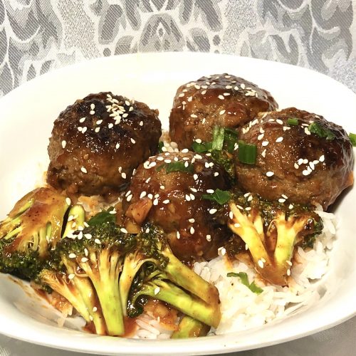 korean meatballs with gochujang sauce, broccoli, white rice and sesame seeds