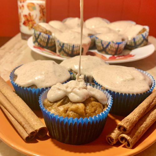 pumpkin muffin with eggnog glaze drizzling over the top