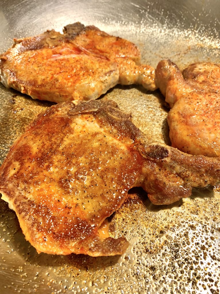 spanish rice pork frying in pan