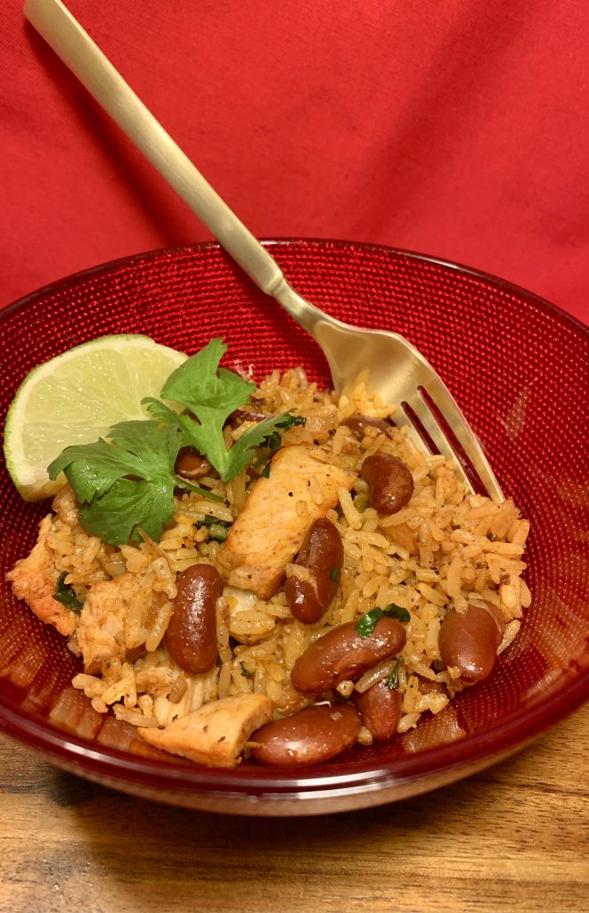 spanish rice in red bowl with fork