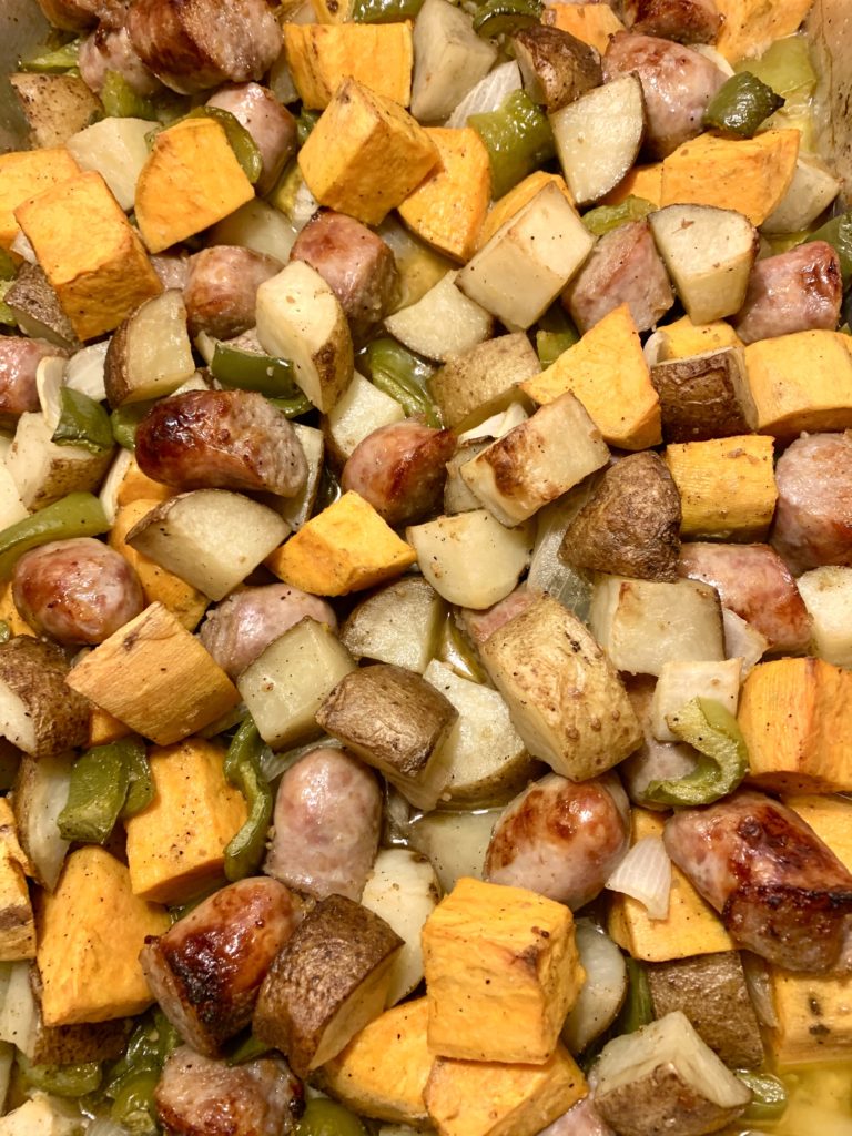 roasted sausage pepper and onion with russet and sweet potatoes on a sheet pan