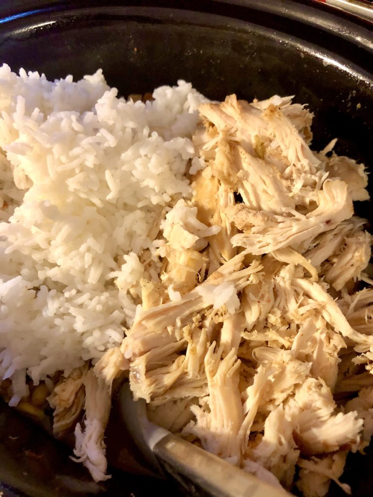 rice and shredded chicken added to slow cooker