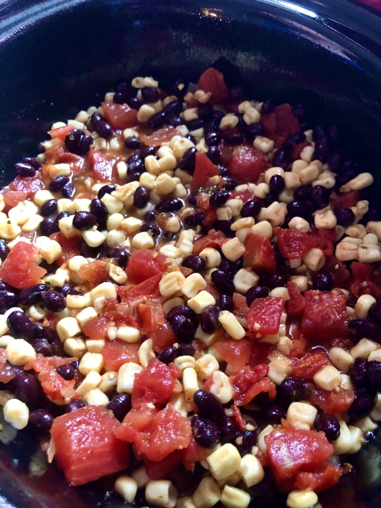 slow cooker mexican shredded chicken with cans of diced tomatoes, black beans and corn with poblanos