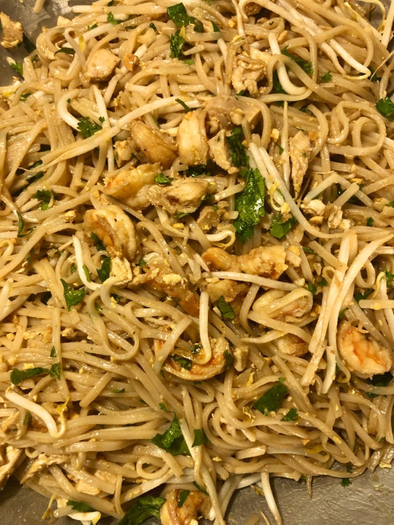 pad thai with bean sprouts, cilantro, shrimp, chicken and scrambled egg