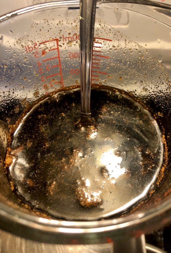 pad thai sauce in a glass measuring cup