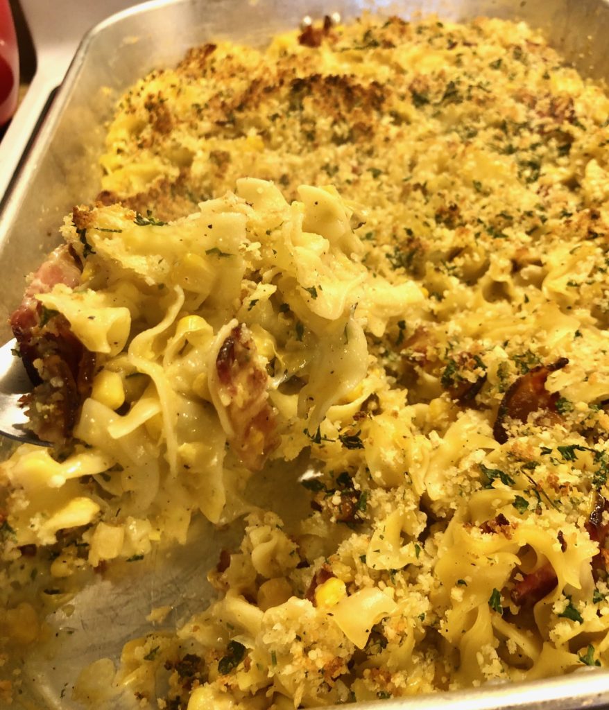 baked corn chowder egg noddle casserole with bacon and topped with panko breadcrumb mixture