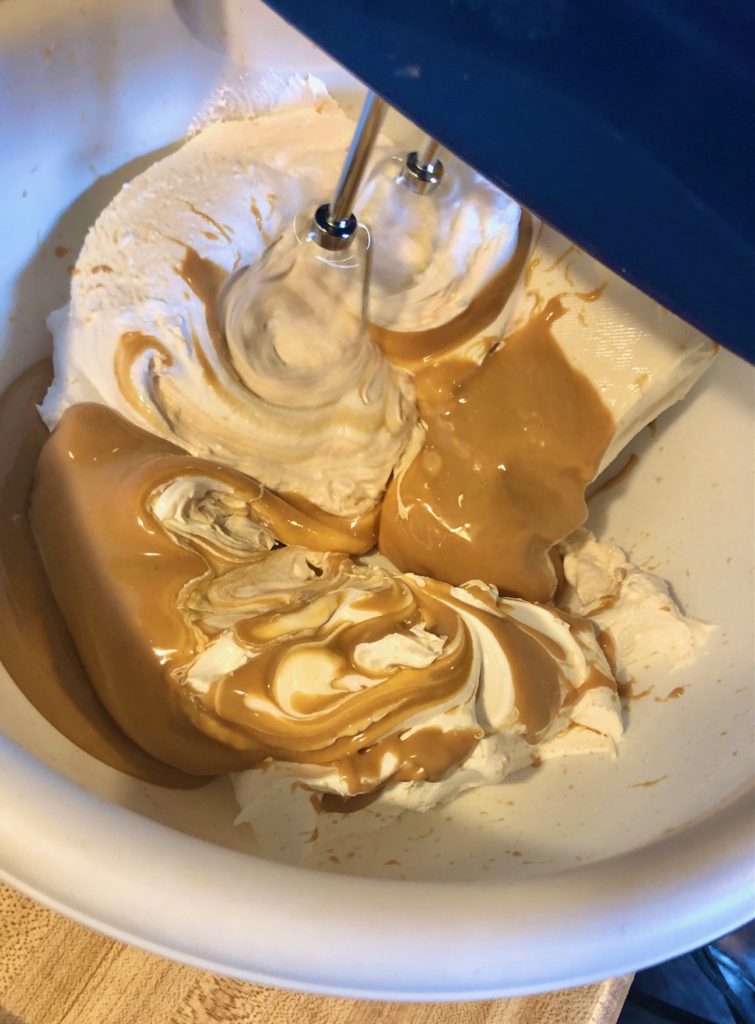cool whip, cream cheese, peanut butter being whipped with electric mixer