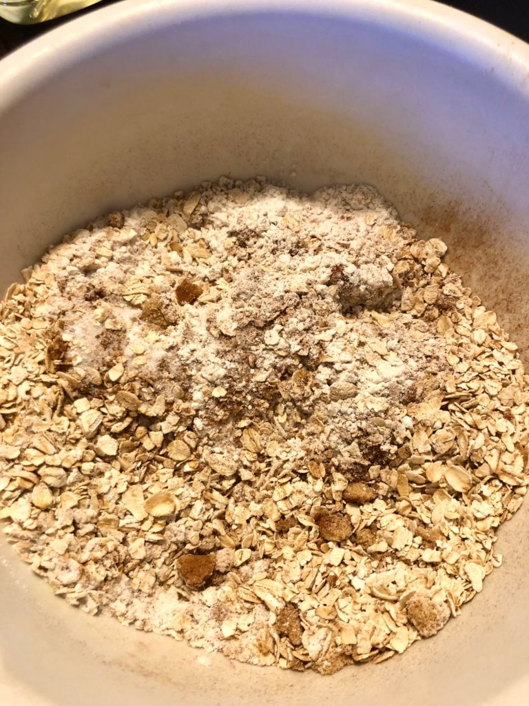 oats, flour, sugar, brown sugar, cinnamon and salt in medium white mixing bowl