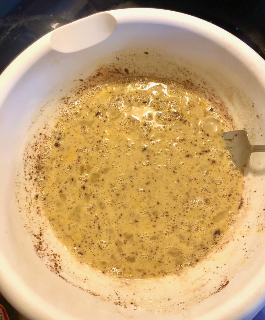 french toast cinnamon egg mixture in large white mixing bowl