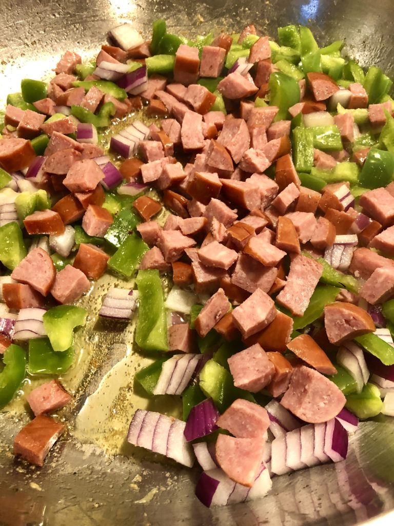 kielbasa, green pepper and onion in frying pan