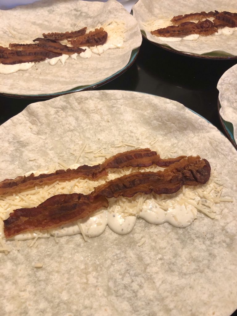 flour tortilla wrap with Caesar dressing, parmesan cheese and bacon
