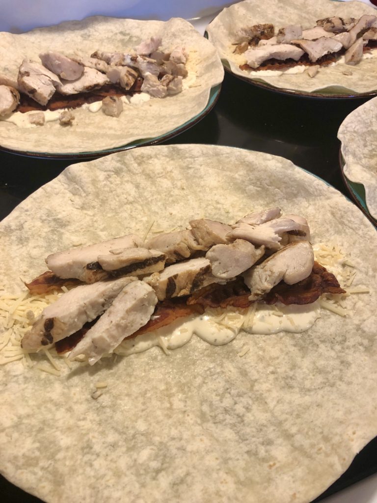 flour tortilla wrap with Caesar dressing, parmesan cheese, bacon and Perdue chicken shortcuts