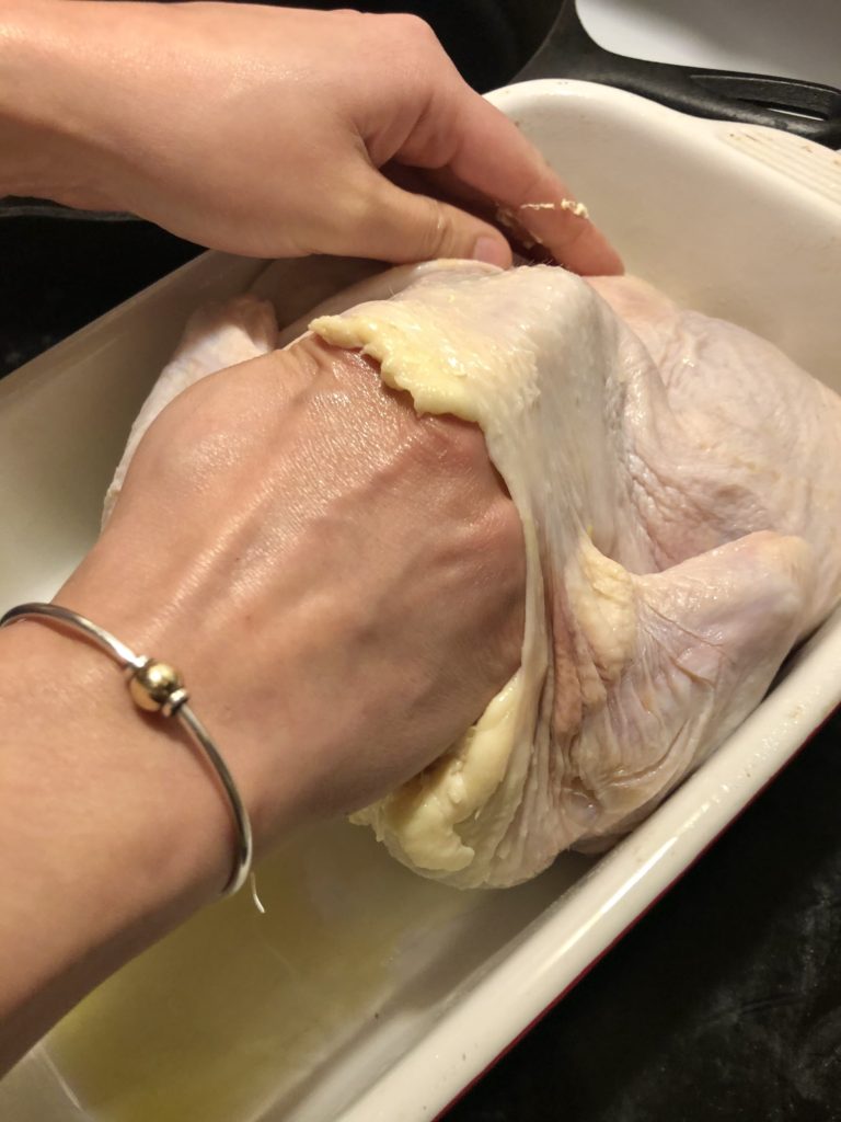 separating skin from the meat on a whole roaster chicken