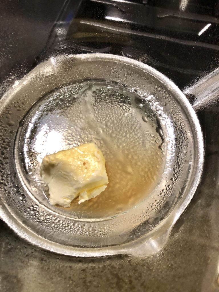 butter, vanilla extract and peppermint extract being heated on double boiler over stovetop