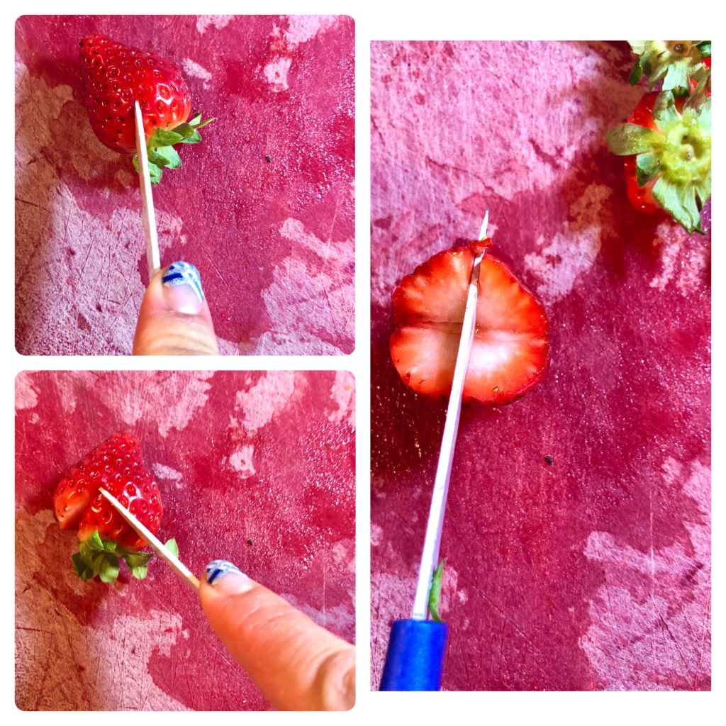 three photo collage showing how to cut a strawberry into a heart shape. two photos are showing the stem and leaves being cut out with small knife and the third photo shows the strawberry being sliced in half lengthwise to create two hearts