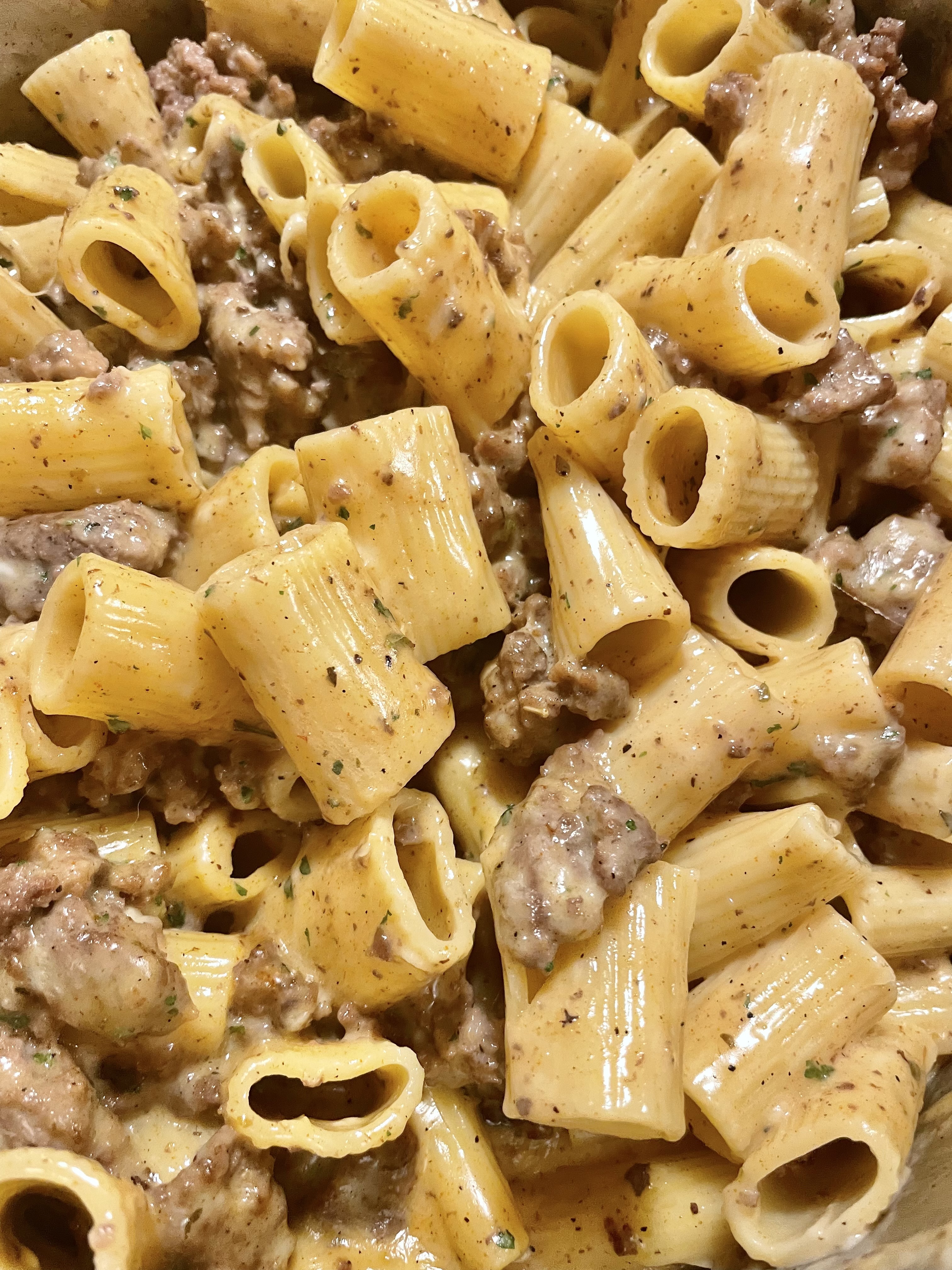 Closeup shot of Homemade Hamburger Helper showing rigatoni, ground beef, cheese sauce and spices.