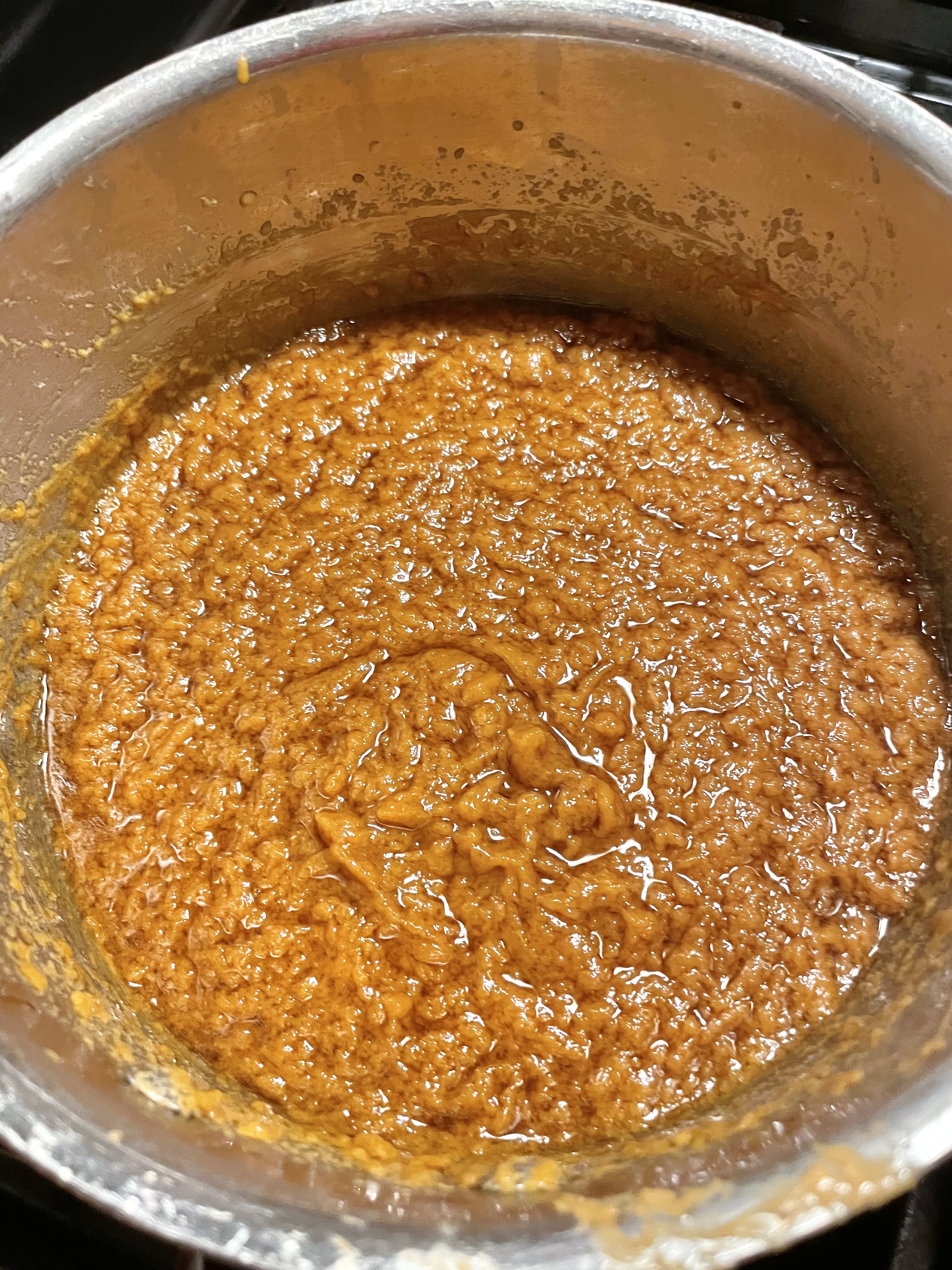 Peanut sauce cooking in saucepan.