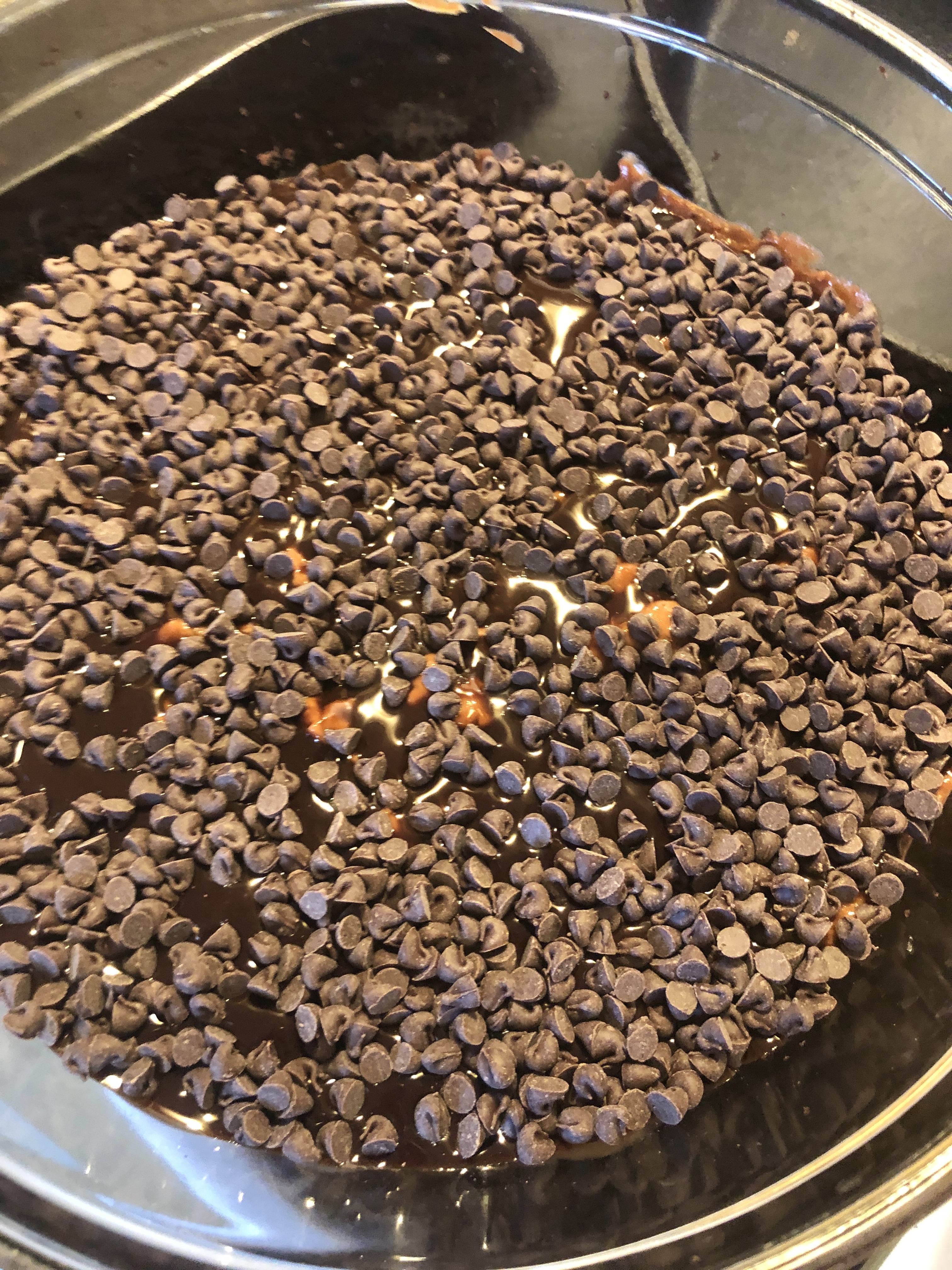Mini chocolate chips layered in trifle bowl.