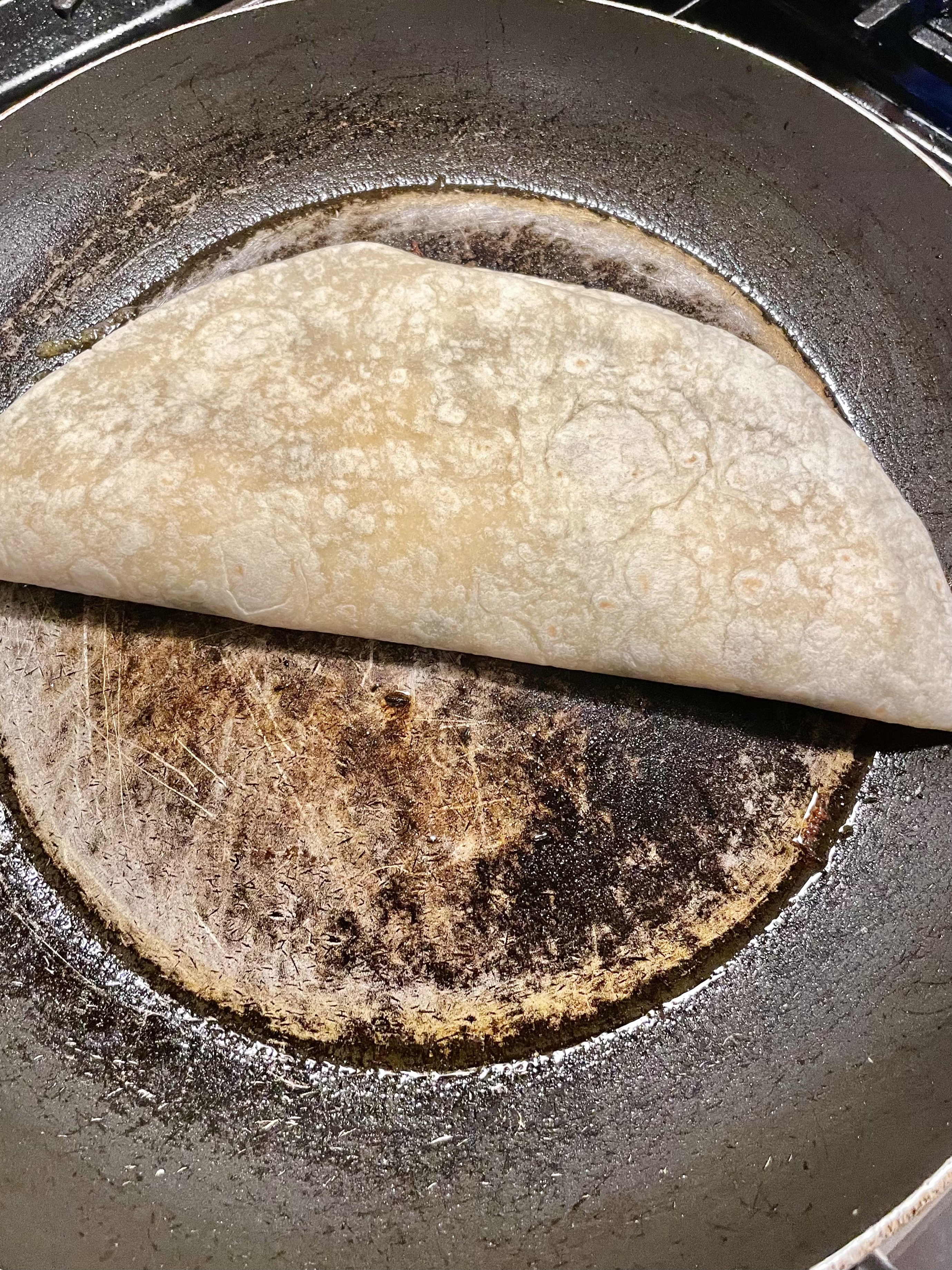 Steak bomb quesadilla added to pan sprayed skillet.
