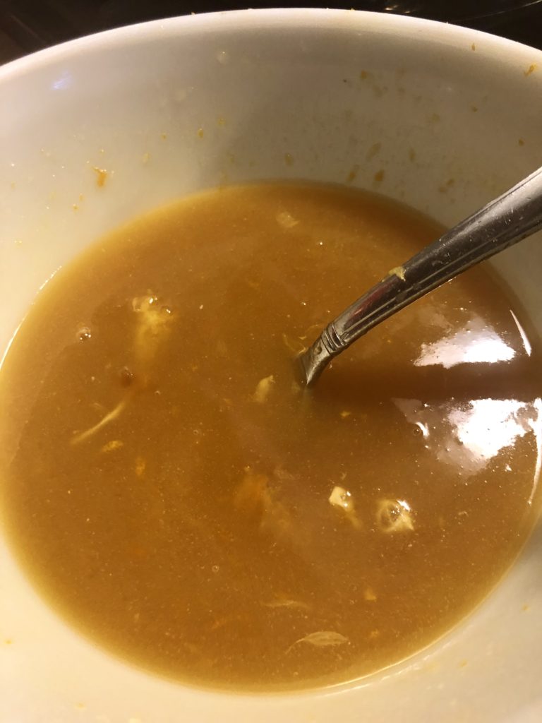 Apricot preserve, brown sugar, butter, salt and the zest and juice of an orange are microwaved in a white bowl to make a glaze.