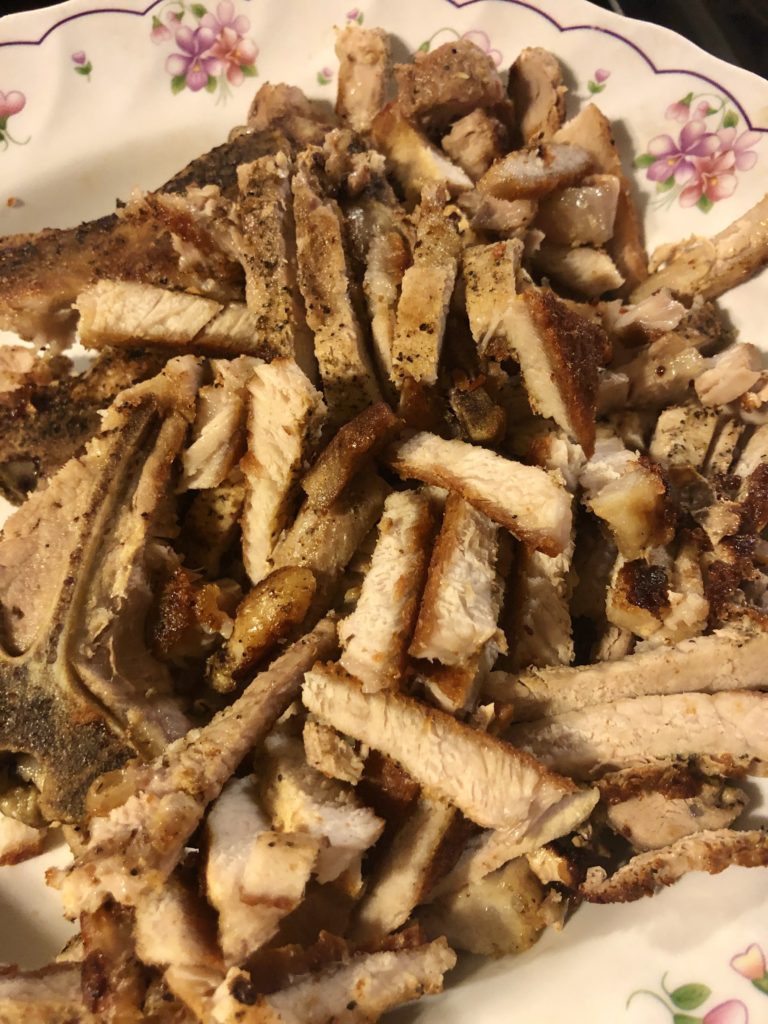 Thinly sliced cooked pork chops.