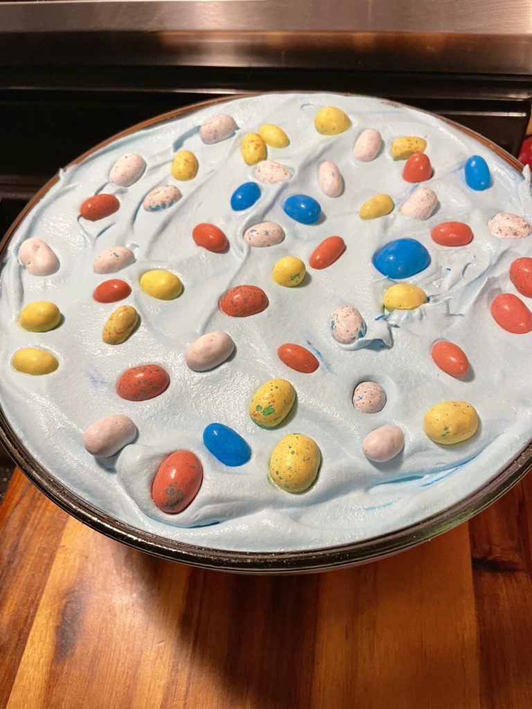 Top view of Easter Trifle showing a layer of blue Cool Whip and Whoppers Mini Robin Eggs.